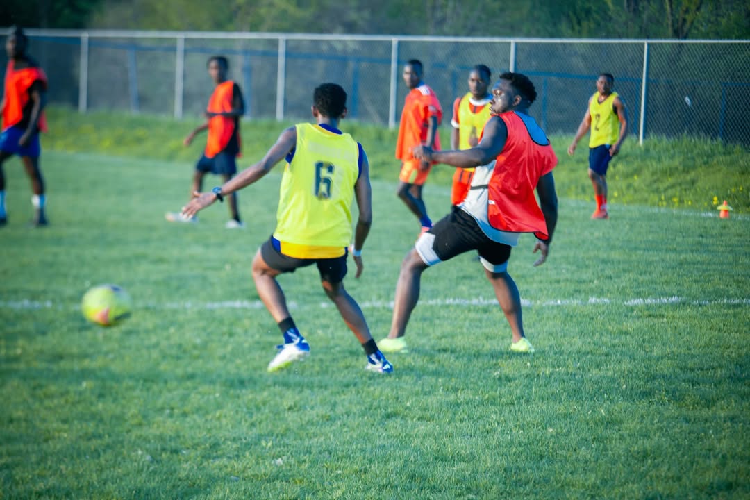 Uganda Cranes Ottawa FC players celebrating together on the field